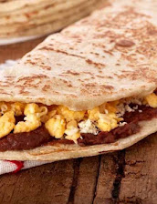Honduran baleada folded with beans, cheese, and eggs